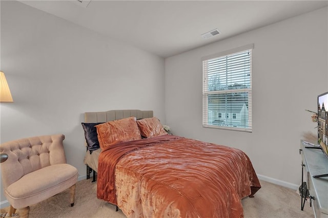 bedroom with carpet, visible vents, and baseboards