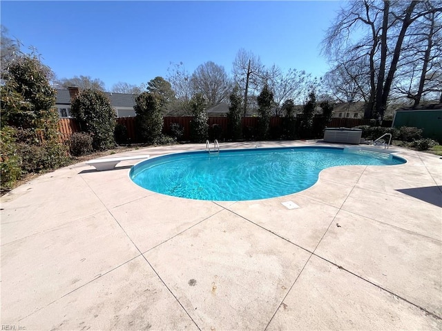 view of pool with a patio area, a fenced in pool, and a fenced backyard