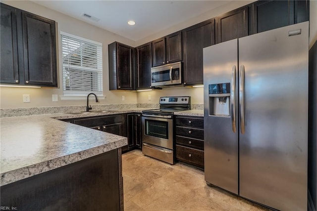 kitchen with visible vents, a sink, recessed lighting, appliances with stainless steel finishes, and light countertops