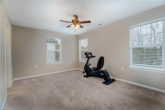 exercise room featuring a ceiling fan, carpet flooring, baseboards, and visible vents