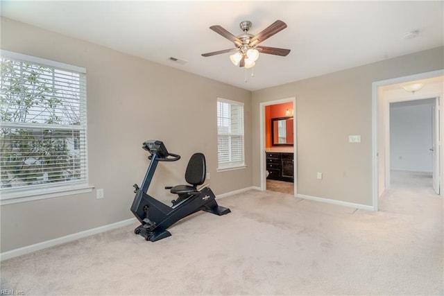 workout room featuring visible vents, carpet flooring, a ceiling fan, and baseboards