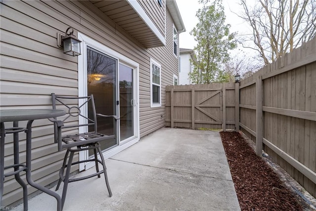 view of patio / terrace featuring fence