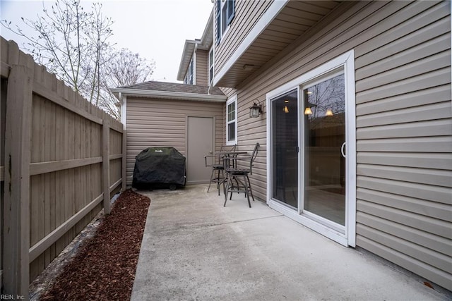 view of patio / terrace featuring fence