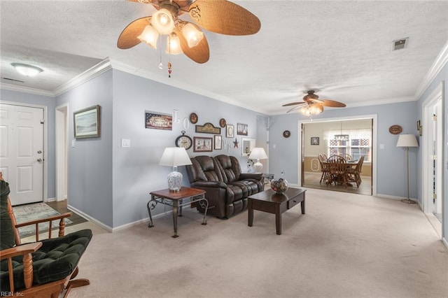 living room featuring visible vents, a textured ceiling, ornamental molding, and carpet flooring