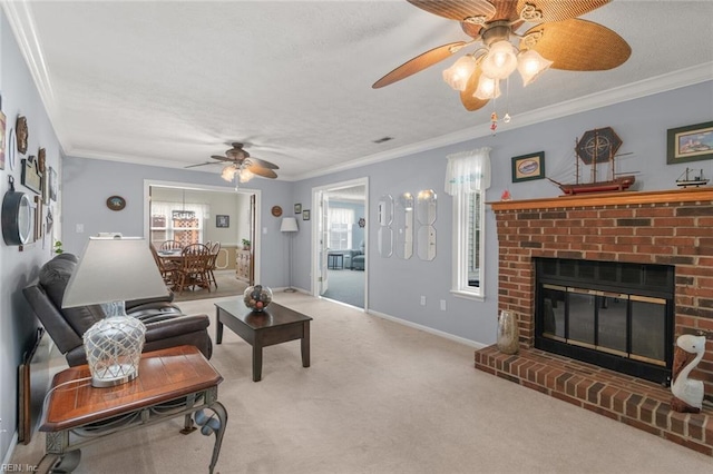 carpeted living area featuring baseboards, a textured ceiling, a fireplace, and crown molding