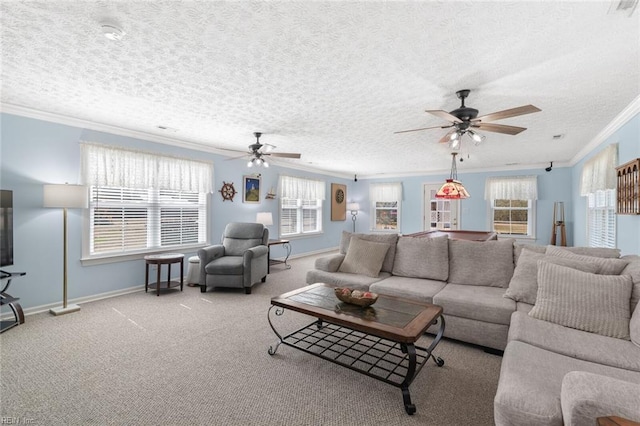 living room with baseboards, a textured ceiling, ornamental molding, and carpet flooring