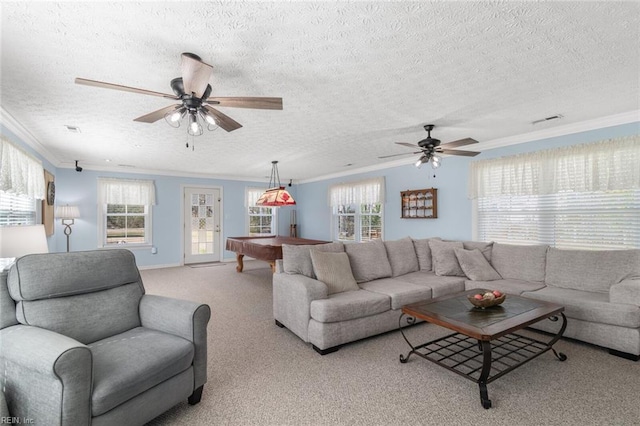 carpeted living room with a wealth of natural light, visible vents, pool table, and ornamental molding