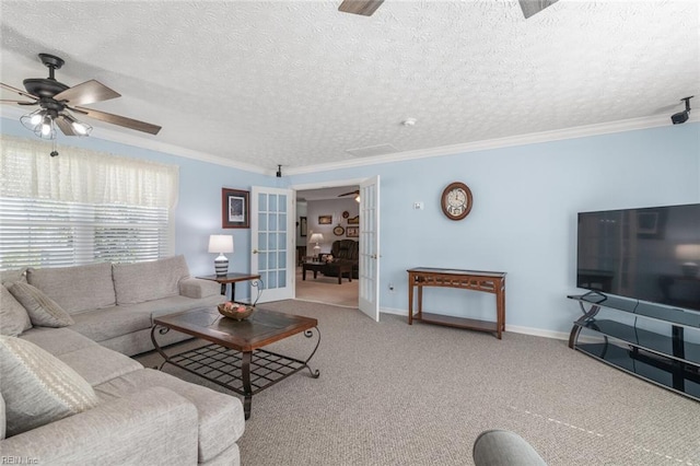 carpeted living room with baseboards, ceiling fan, french doors, a textured ceiling, and crown molding