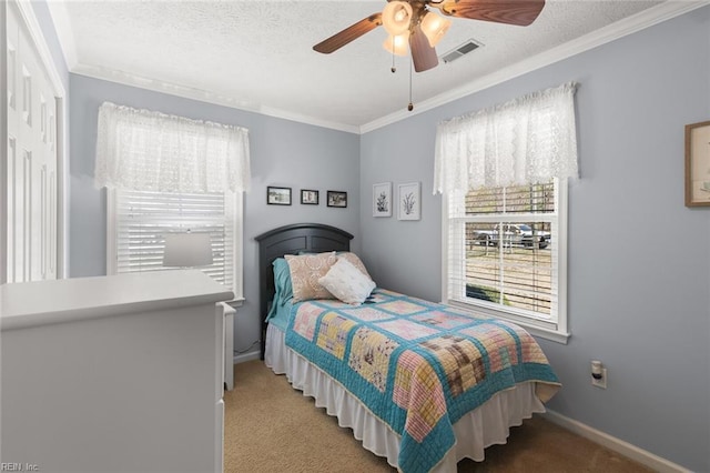 bedroom featuring baseboards, visible vents, carpet floors, and a textured ceiling