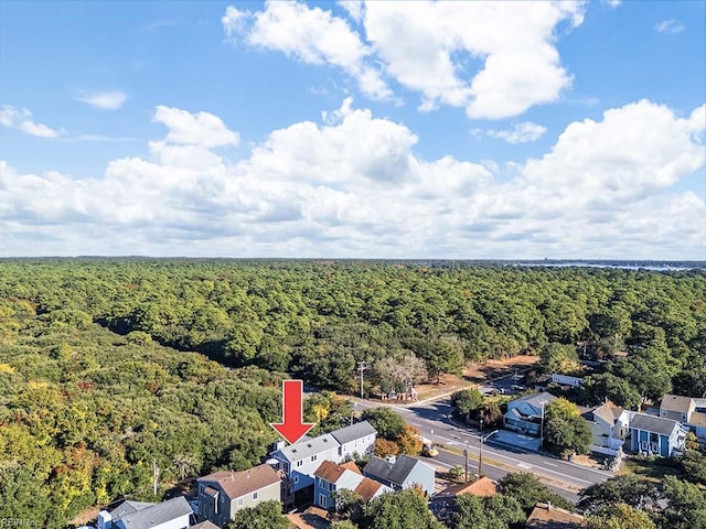 birds eye view of property with a residential view and a wooded view