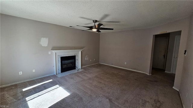 unfurnished living room with a ceiling fan, visible vents, a fireplace, a textured ceiling, and carpet flooring