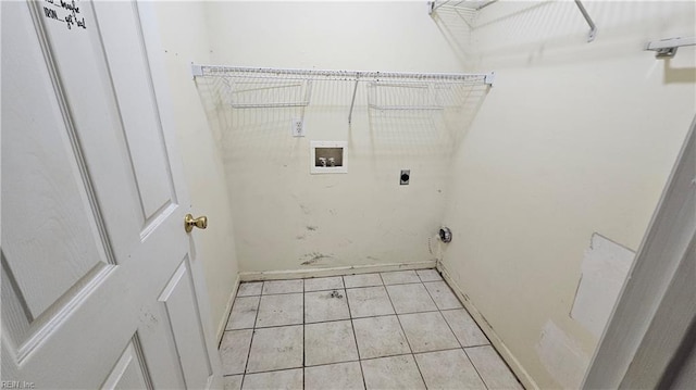 washroom featuring light tile patterned floors, laundry area, hookup for a washing machine, and electric dryer hookup