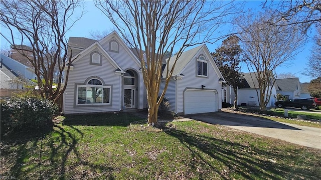 view of front of house featuring concrete driveway, an attached garage, and a front yard