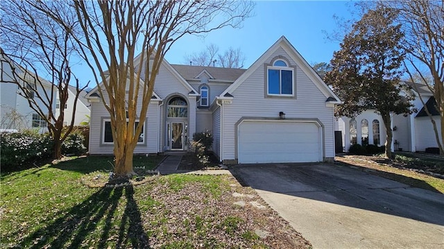 traditional home with concrete driveway, an attached garage, and a front lawn