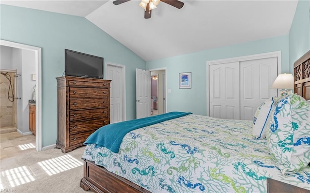 bedroom with light carpet, a ceiling fan, ensuite bath, baseboards, and vaulted ceiling