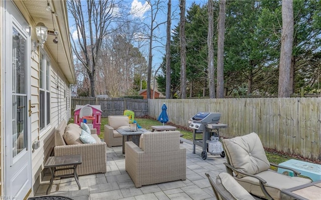 view of patio / terrace featuring an outdoor hangout area, area for grilling, and a fenced backyard