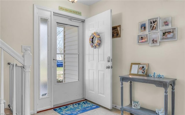 entrance foyer with a wealth of natural light and stairway