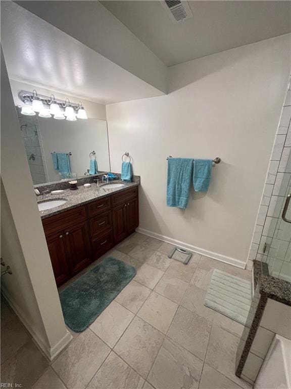 full bathroom featuring a sink, visible vents, a stall shower, and double vanity