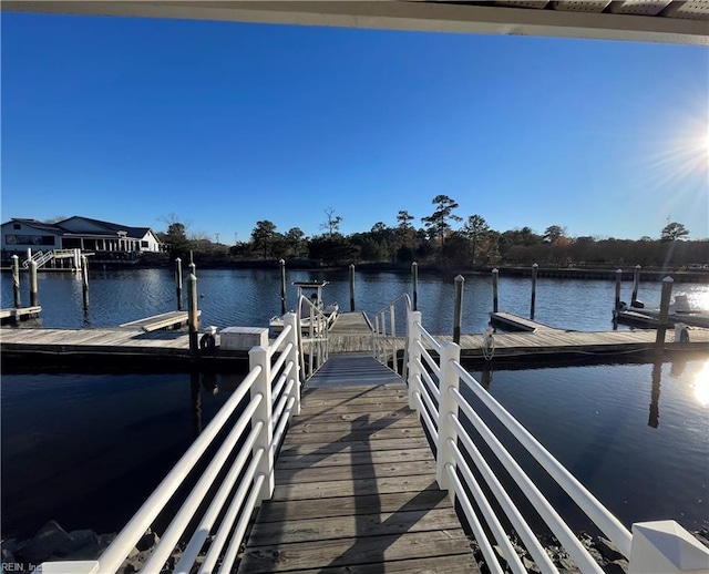 dock area with a water view