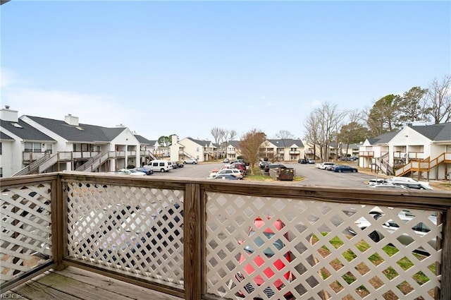 wooden terrace with a residential view