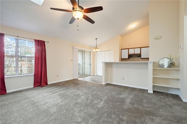 unfurnished living room with baseboards, carpet, and lofted ceiling