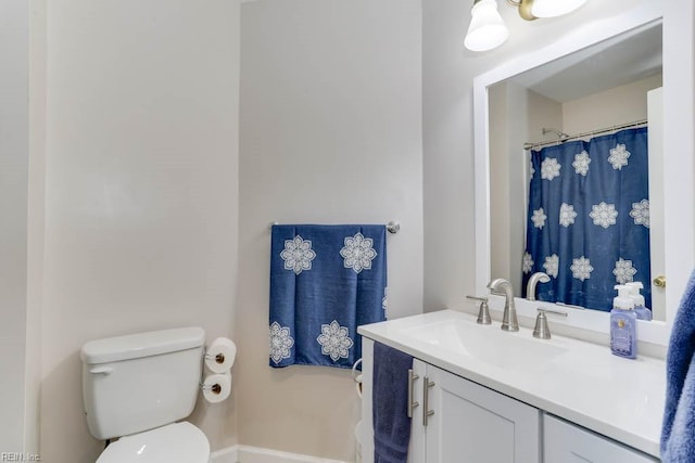 full bathroom featuring toilet and vanity