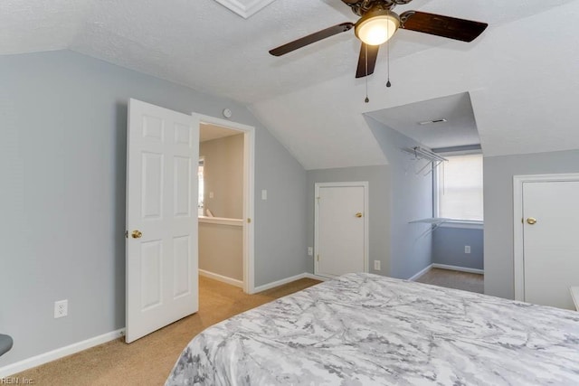 bedroom featuring carpet flooring, ceiling fan, baseboards, and vaulted ceiling