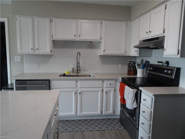 kitchen with under cabinet range hood, dishwasher, range with electric stovetop, white cabinetry, and a sink