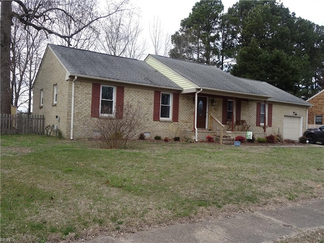 ranch-style home featuring brick siding, an attached garage, a front yard, and fence