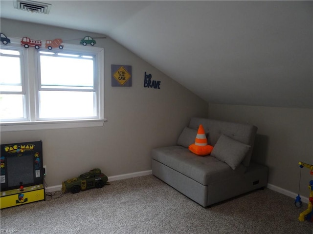 sitting room featuring visible vents, lofted ceiling, carpet, and baseboards