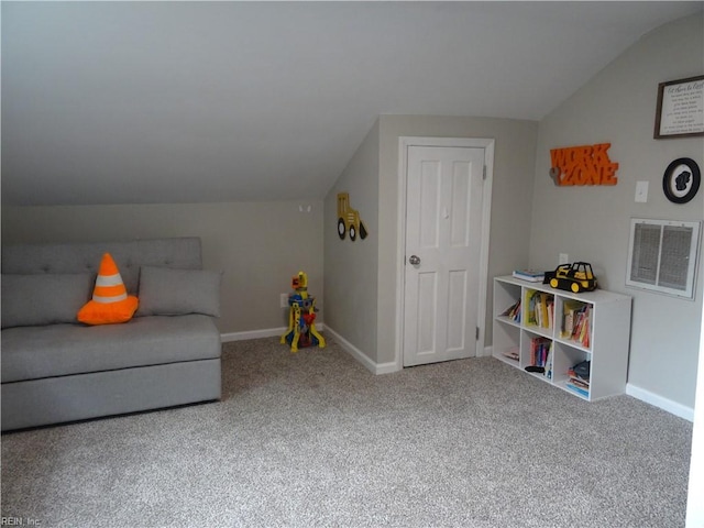 sitting room with vaulted ceiling, baseboards, visible vents, and carpet floors