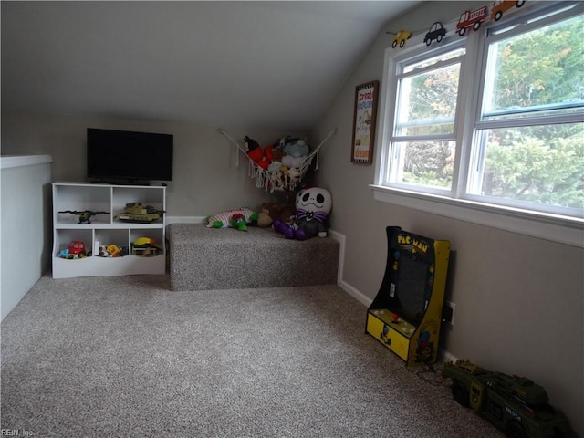 recreation room featuring lofted ceiling and carpet floors