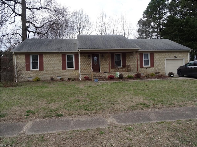 ranch-style home with crawl space, an attached garage, a front lawn, and brick siding