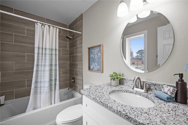 full bathroom featuring vanity, shower / tub combo, and toilet