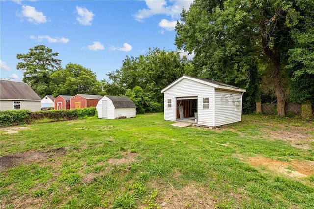 view of yard featuring an outbuilding and a storage unit