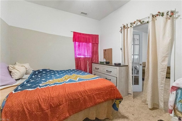 carpeted bedroom with visible vents