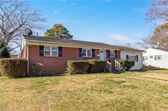 ranch-style house with brick siding and a front lawn