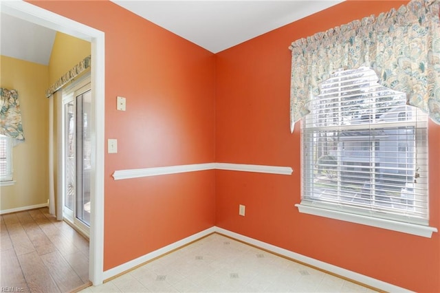 interior space featuring baseboards