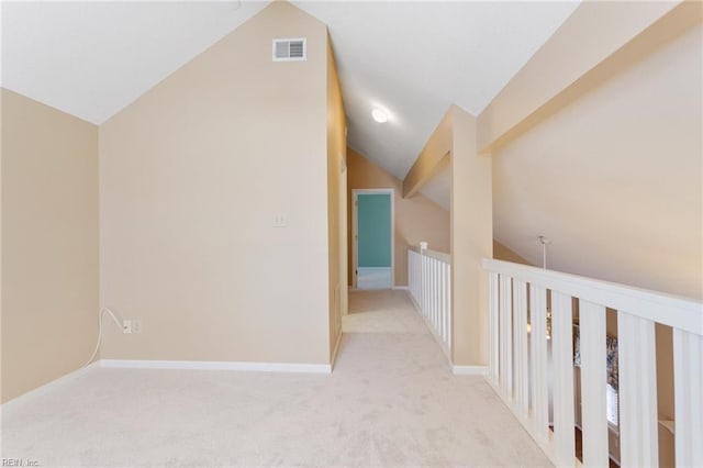 bonus room with lofted ceiling, carpet, visible vents, and baseboards