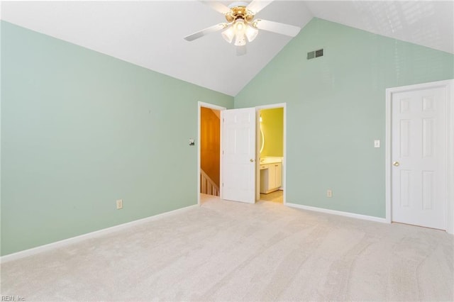 unfurnished bedroom with high vaulted ceiling, visible vents, and light carpet