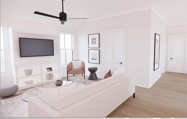 living room featuring light wood finished floors, baseboards, ceiling fan, and vaulted ceiling