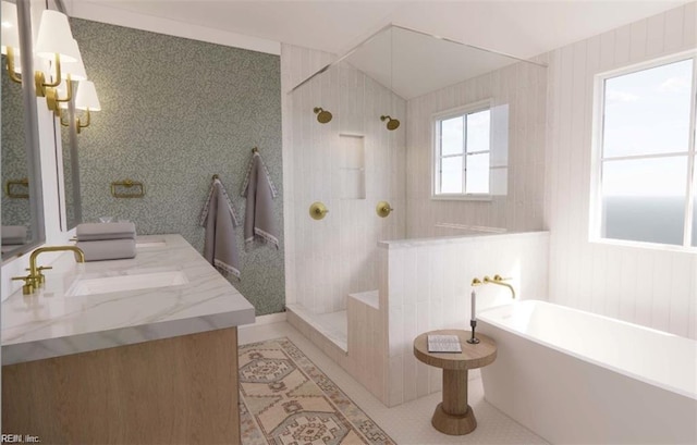 bathroom featuring tile patterned floors, a freestanding tub, vanity, and a walk in shower