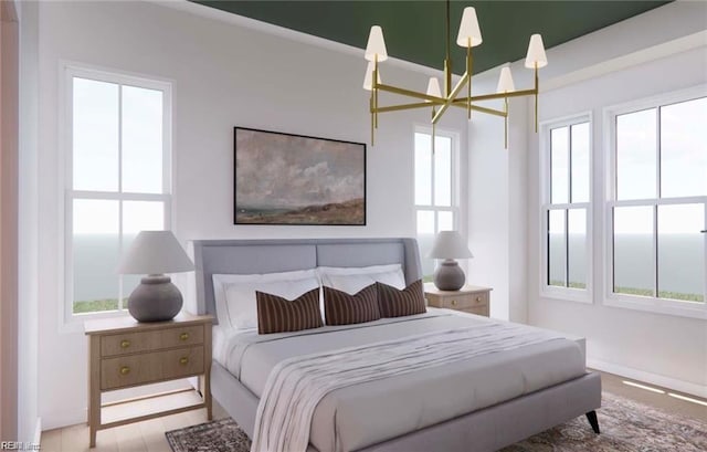 bedroom featuring wood finished floors and a chandelier