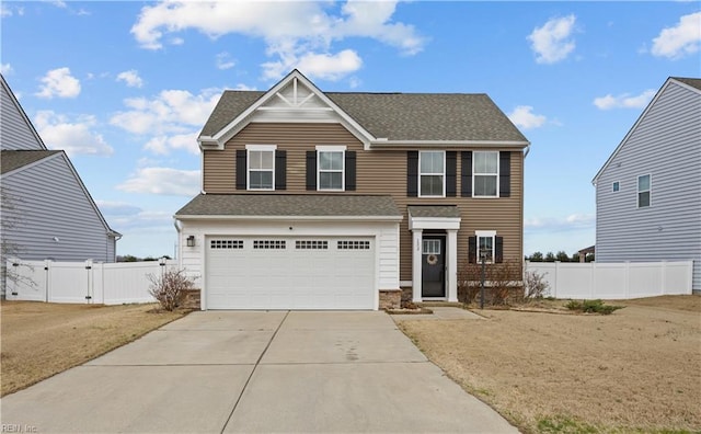 view of front of house with a gate, fence, roof with shingles, concrete driveway, and an attached garage