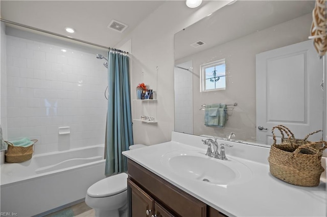 full bathroom with visible vents, shower / bath combo with shower curtain, toilet, and vanity