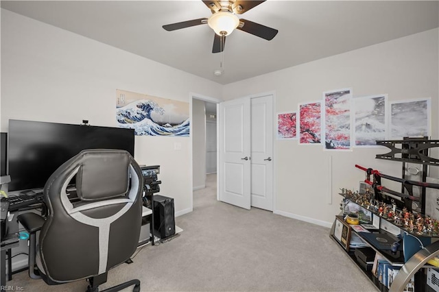 home office featuring baseboards, carpet, and ceiling fan