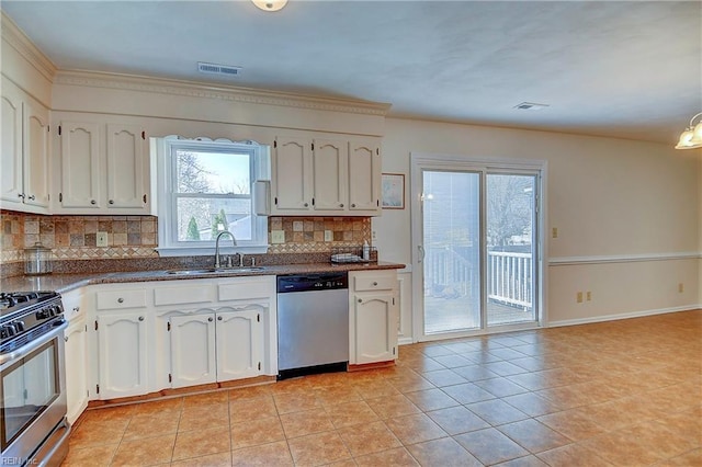 kitchen featuring visible vents, a sink, backsplash, stainless steel appliances, and light tile patterned floors