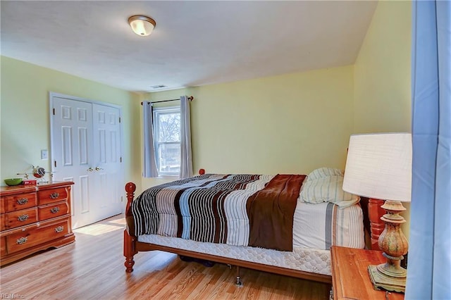 bedroom with a closet and wood finished floors