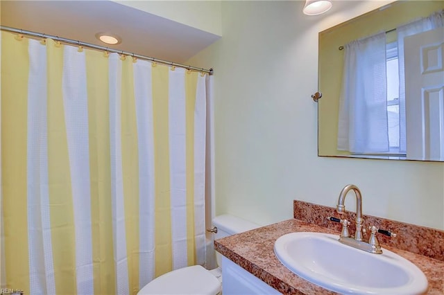 full bathroom with vanity, toilet, and a shower with curtain