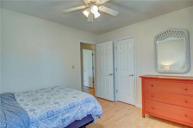 bedroom featuring light wood-style flooring and ceiling fan